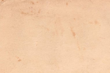 Kitabın kapağında lekeler olan eski sarı kağıt..