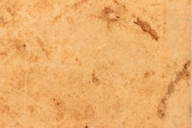 Eski kahverengi karton lekelerle kaplı..