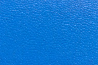 Mavi eski dermatin yüzeyinde küçük bir desen var..