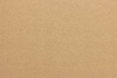 Yoğun ışıklı bir karton kağıdın tekdüze dokusu.