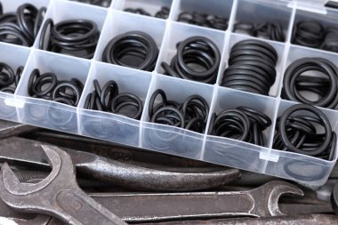 A set of rubber O-rings for pneumatics and hydraulics and old locksmith tools. clipart