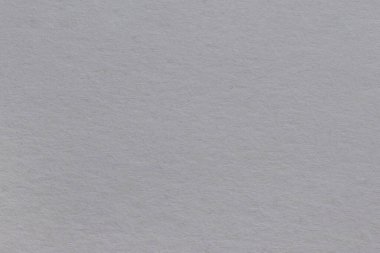 Doku eski gri kağıttan, lekelerle kaplı. Işıksız fibröz yapı.