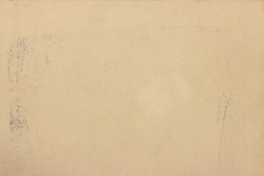 Eski, sarı kağıdın hafif dokusu, mürekkep lekeleriyle kaplı..