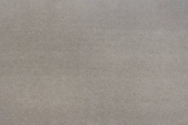 Yoğun ışıklı bir karton kağıdın tekdüze dokusu.