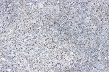 Renkli desenli yontulmuş granit levha dokusu. Doğal taştan yapılmış duvarlara bakan malzeme..