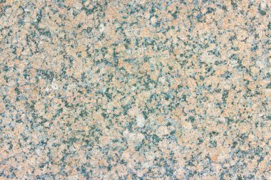 Renkli desenli yontulmuş granit levha dokusu. Doğal taştan yapılmış duvarlara bakan malzeme..