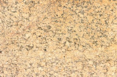 Renkli desenli yontulmuş granit levha dokusu. Doğal taştan yapılmış duvarlara bakan malzeme..