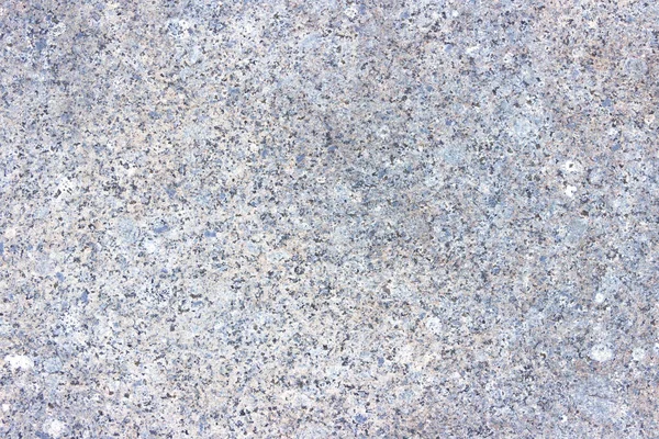 Renkli desenli yontulmuş granit levha dokusu. Doğal taştan yapılmış duvarlara bakan malzeme..
