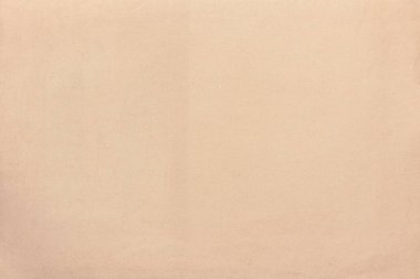 Eski, sarı kağıdın hafif dokusu, mürekkep lekeleriyle kaplı..