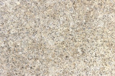 Renkli desenli yontulmuş granit levha dokusu. Doğal taştan yapılmış duvarlara bakan malzeme..