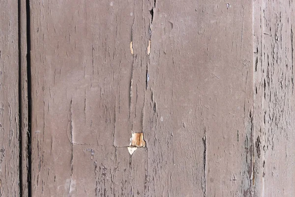 天気の良い日と木製のドアの表面 剥離塗料 古木板の質感 — ストック写真