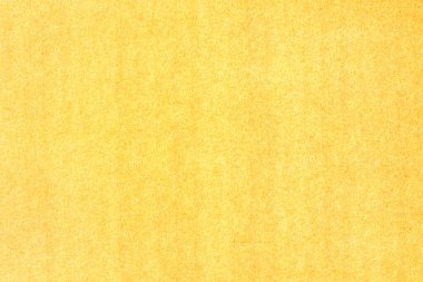 Sarı renkli bir kağıt parçası. Sert pürüzsüz doku.
