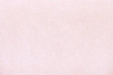 Pürüzsüz bir kağıt parçasının açık renk deseni. Kartonun yüzeyinde küçük eklemeler var..