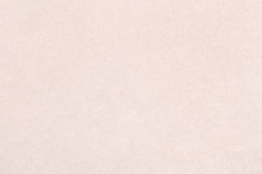 Pürüzsüz bir kağıt parçasının açık renk deseni. Kartonun yüzeyinde küçük eklemeler var..