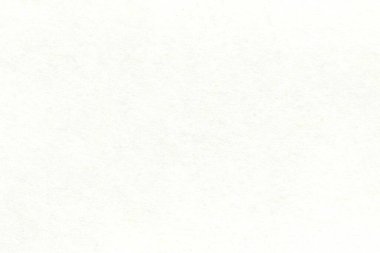 Pürüzsüz bir kağıt parçasının açık renk deseni. Kartonun yüzeyinde küçük eklemeler var..