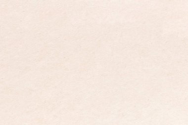 Pürüzsüz bir kağıt parçasının açık renk deseni. Kartonun yüzeyinde küçük eklemeler var..