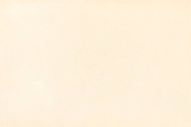 Pürüzsüz bir kağıt parçasının açık renk deseni. Kartonun yüzeyinde küçük eklemeler var..