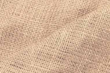 Büyük hücreli doğal çuval bezi. Kabaca örülmüş kumaş dokusu ağ ve liflerle.