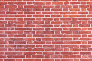 Eski bir evde tuğla bir duvar. Eski tuğla işçiliğinin dokusu.