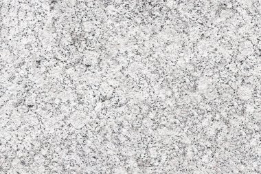Granit levhanın benekli yüzeyi ince benekli. Doğal taşın tekdüze dokusu.