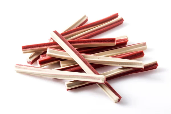 Yummy meat flavor dog treat sticks on background — Stock Photo, Image