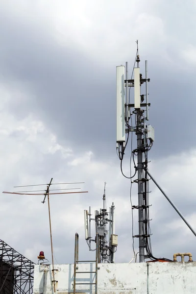 Mobile phone transmission pole on top of building