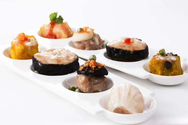 Delicious variety steamed Dim sum on plate Stock Picture