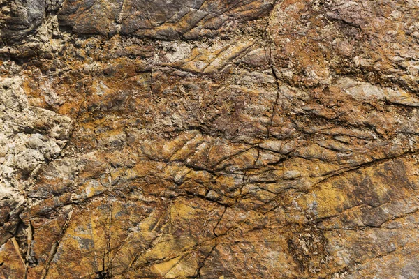 Cracked and weathered natural stone background — Stock Photo, Image