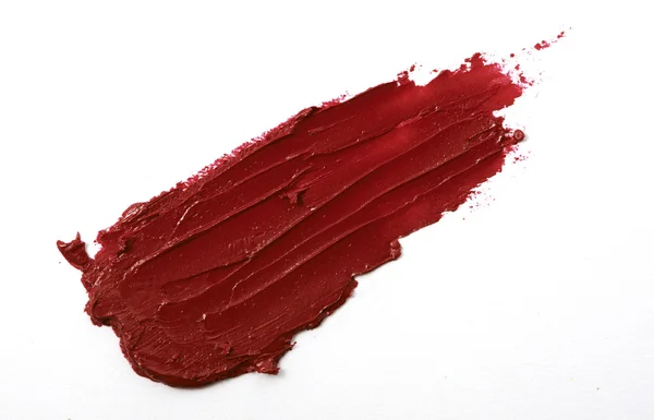 Red color lipstick stroke on white paper — Stock Photo, Image