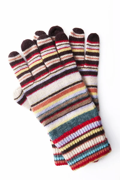 Bunte Winterhandschuhe auf weißem Hintergrund — Stockfoto