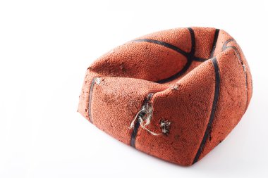 Old damaged rubber basket ball on background clipart