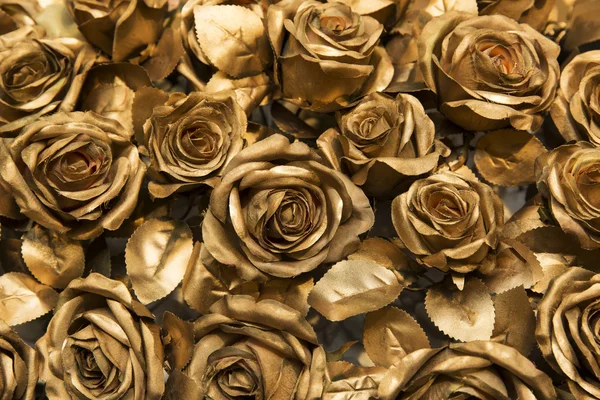 Golden fabric roses background — Stock Photo, Image