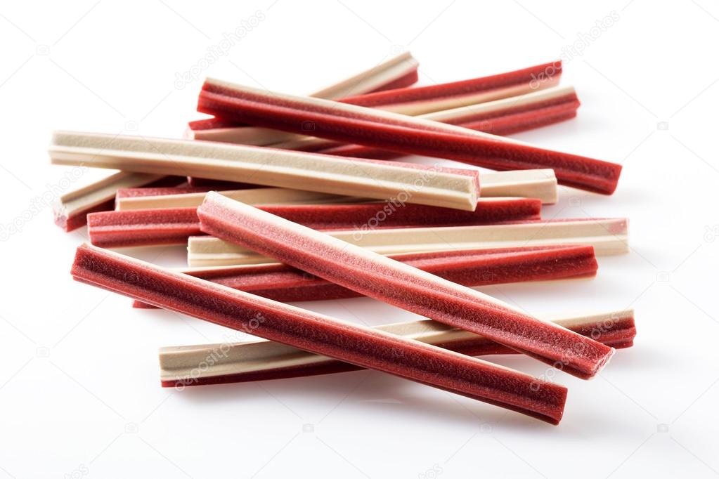 Yummy meat flavor dog treat sticks on background