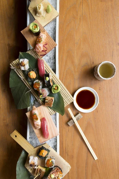 Group of sushi serve on wooden plate,top view — Stock Photo, Image