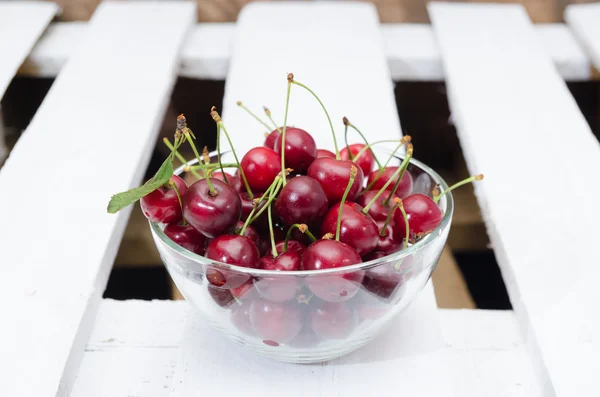 Cherries in a glass bowl — Stock Photo, Image
