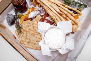 Catering. Snacks and goodies. Scrap delivery set. Jam, biscuits, sausage, cheese, orange and more