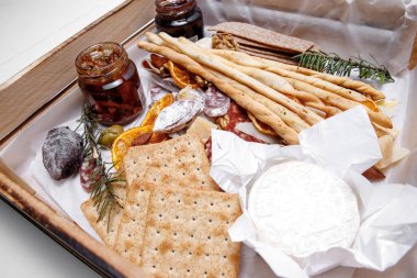 Catering. Snacks and goodies. Scrap delivery set. Jam, biscuits, sausage, cheese, orange and more