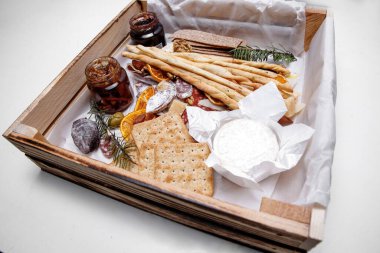 Catering. Snacks and goodies. Scrap delivery set. Jam, biscuits, sausage, cheese, orange and more