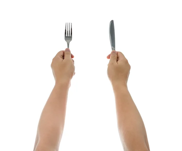 Un cuțit și furculiță fiind ținute de mâinile omului. Izolat — Fotografie, imagine de stoc