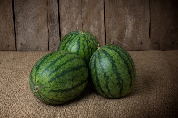 Tasty watermelon on wooden background — Stock Photo, Image