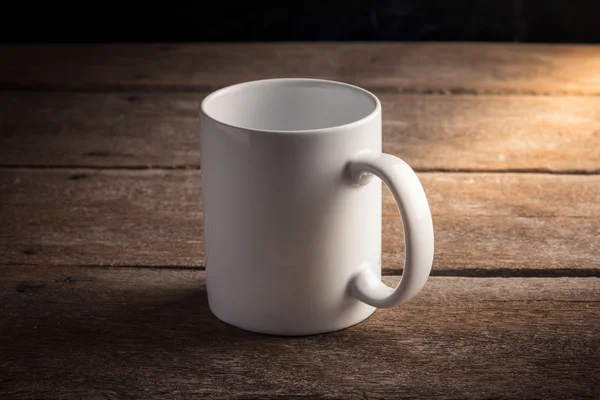 Cup of coffee on wooden table — Stock Photo, Image