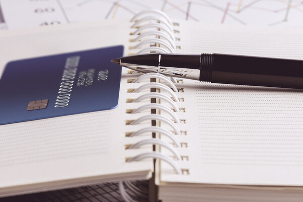 Credit card and ball pen on a organizer