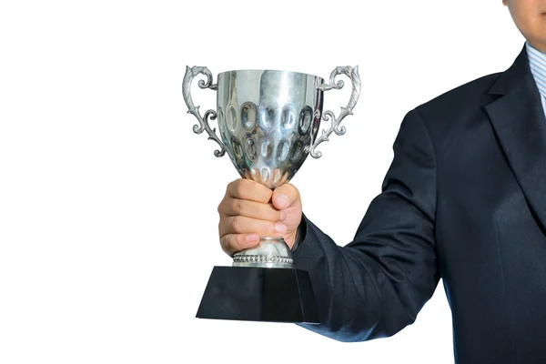 Empresário segurando um troféu de prata campeão no fundo branco — Fotografia de Stock