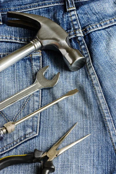 Several tools on a denim workers pocket — Stock Photo, Image