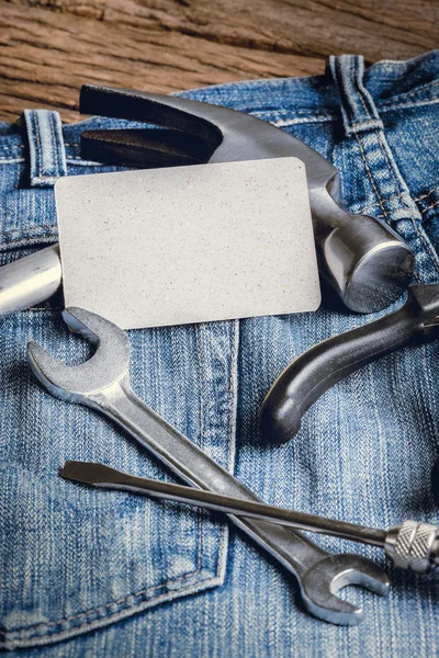 Several tools on a denim workers pocket — Stock Photo, Image