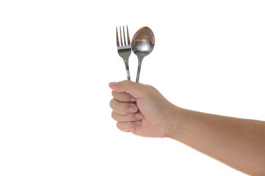 Çatal ve kaşık izole bir adamın elleri tarafından düzenlenen