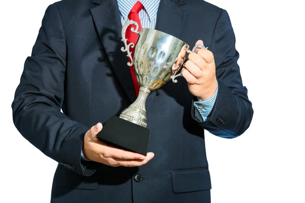 Empresário, vencedor com terno segurando um troféu no backgrou branco — Fotografia de Stock