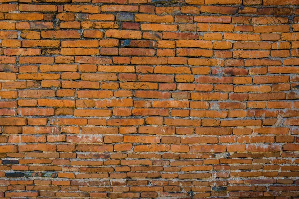 Vecchio muro di mattoni in uno sfondo — Foto Stock