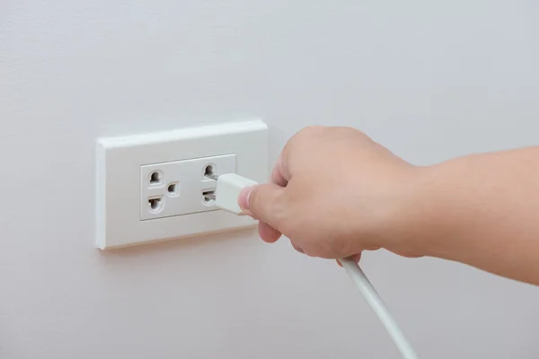 Unplug or plugged in concept Stock Picture