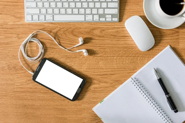 Office table with notepad, computer, coffee cup, computer mouse — Stock Photo, Image